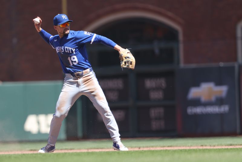 May 21, 2025; San Francisco, California, USA; Kansas City Royals second baseman Michael Massey (19) throws the ball to first base against the San Francisco Giants during the eighth inning at Oracle Park. Mandatory Credit: Kelley L Cox-Imagn Images