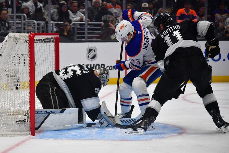 Apr 29, 2025; Los Angeles, California, USA; Los Angeles Kings center Anze Kopitar (11) helps goaltender Darcy Kuemper (35) defend the goal against Edmonton Oilers center Ryan Nugent-Hopkins (93) during the third period in game five of the first round of the 2025 Stanley Cup Playoffs at Crypto.com Arena. Mandatory Credit: Gary A. Vasquez-Imagn Images
