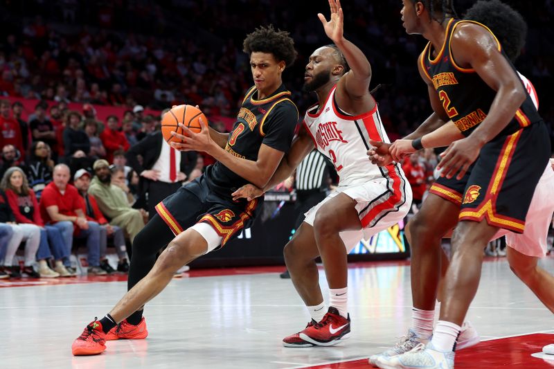 Feb 11, 2026; Columbus, Ohio, USA;  USC Trojans guard Alijah Arenas (0) controls the ball as Ohio State Buckeyes guard Bruce Thornton (2) defends during the first half at Value City Arena. Mandatory Credit: Joseph Maiorana-Imagn Images
