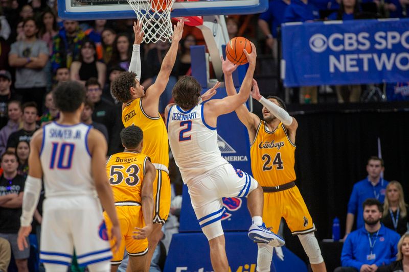 Feb 11, 2023; Boise, Idaho, USA; Boise State Broncos forward Tyson Degenhart (2) shoots over Wyoming Cowboys guard Brendan Wenzel (1) during the first half  at ExtraMile Arena. Mandatory Credit: Brian Losness-USA TODAY Sports

