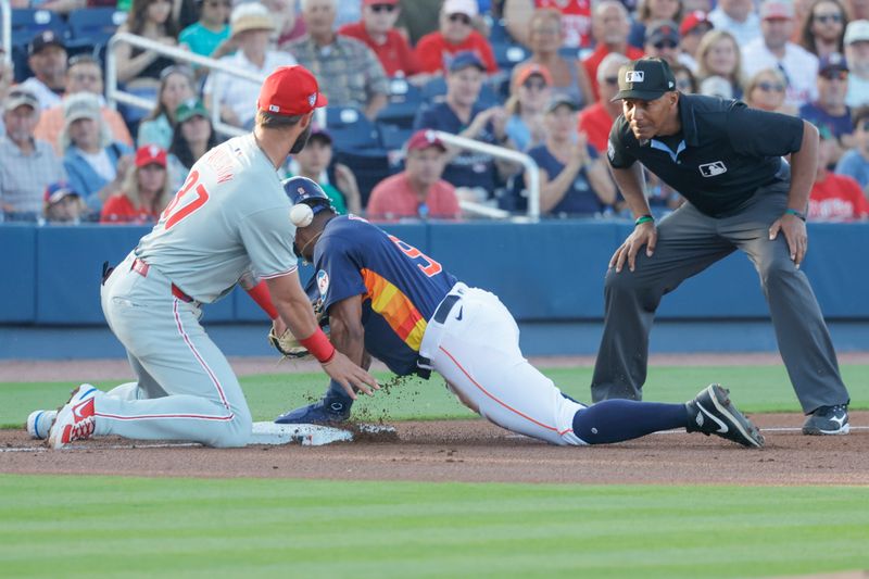 Mar 15, 2024; West Palm Beach, Florida, USA; Houston Astros left fielder Corey Julks (9) slides safely into third against the Philadelphia Phillies during the first inning at The Ballpark of the Palm Beaches. Mandatory Credit: Reinhold Matay-USA TODAY Sports