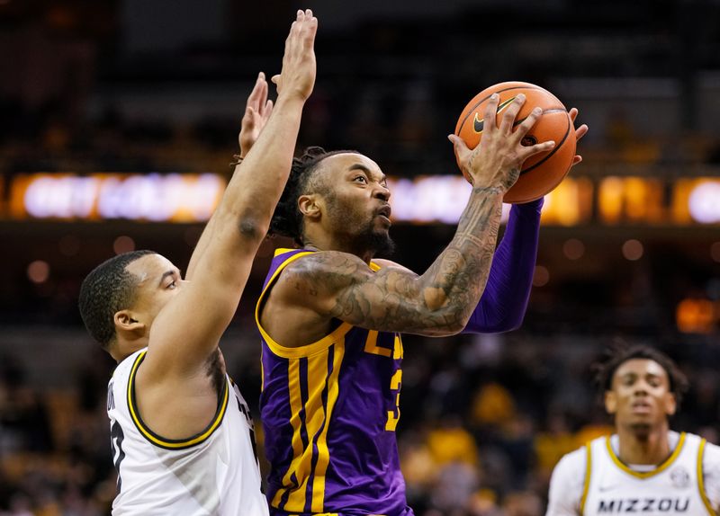 Feb 1, 2023; Columbia, Missouri, USA; LSU Tigers guard Justice Hill (3) shoots against Missouri Tigers guard Nick Honor (10) during the second half at Mizzou Arena. Mandatory Credit: Jay Biggerstaff-USA TODAY Sports