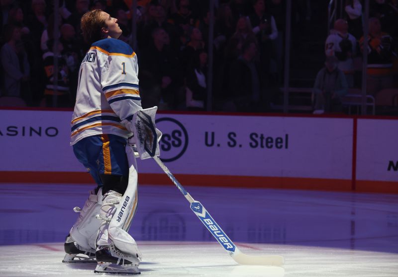 Nov 26, 2025; Pittsburgh, Pennsylvania, USA;  Buffalo Sabres goaltender Ukko-Pekka Luukkonen (1) stands for the national anthem against the Pittsburgh Penguins at PPG Paints Arena. Mandatory Credit: Charles LeClaire-Imagn Images