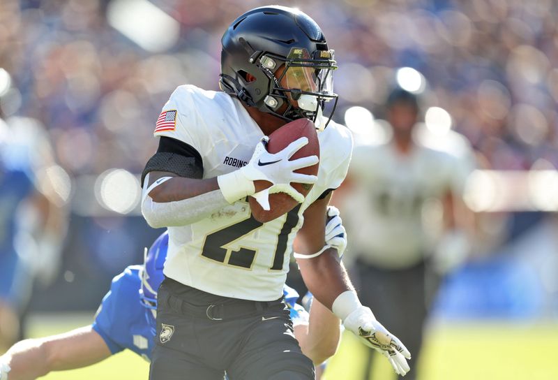 Nov 4, 2023; Denver, Colorado, USA; Army Black Knights running back Tyrell Robinson (21) runs after a catch against the Air Force Falcons during the second half at Empower Field at Mile High. Mandatory Credit: Danny Wild-USA TODAY Sports