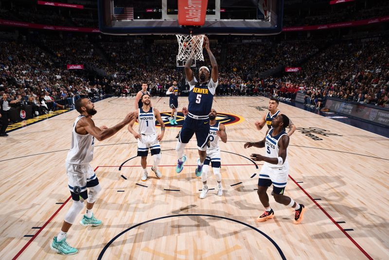 DENVER, CO - APRIL 10: Kentavious Caldwell-Pope #5 of the Denver Nuggets drives to the basket during the game against the Minnesota Timberwolves on April 10, 2024 at the Ball Arena in Denver, Colorado. NOTE TO USER: User expressly acknowledges and agrees that, by downloading and/or using this Photograph, user is consenting to the terms and conditions of the Getty Images License Agreement. Mandatory Copyright Notice: Copyright 2024 NBAE (Photo by Garrett Ellwood/NBAE via Getty Images)