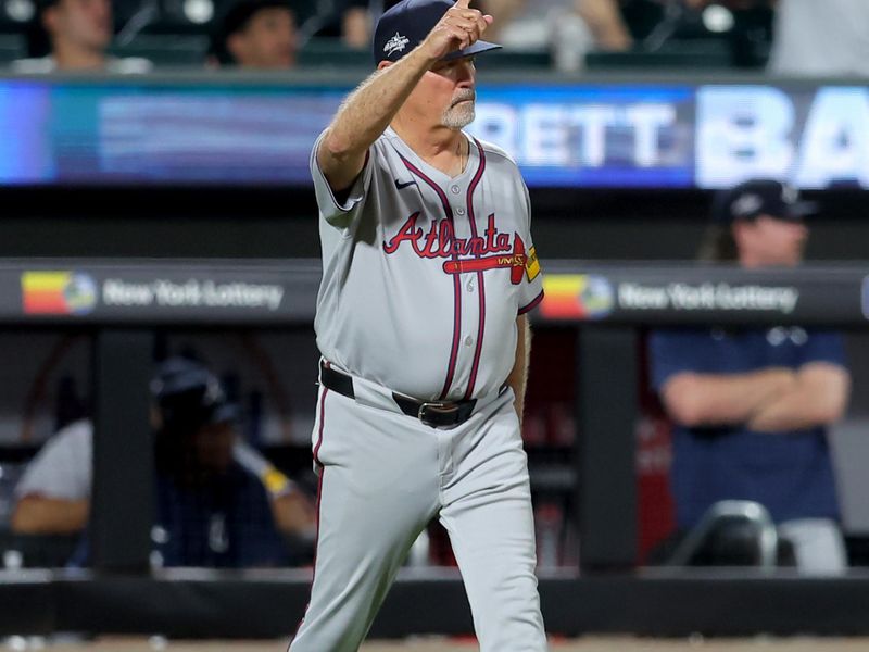 Jun 24, 2025; New York City, New York, USA; Atlanta Braves manager Brian Snitker (43) makes a pitching change during the ninth inning against the New York Mets at Citi Field. Mandatory Credit: Brad Penner-Imagn Images