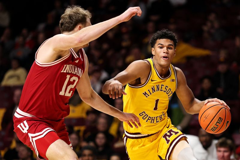 Dec 3, 2025; Minneapolis, Minnesota, USA; Minnesota Golden Gophers guard Isaac Asuma (1) works around Indiana Hoosiers forward Tucker Devries (12) during the first half at Williams Arena. Mandatory Credit: Matt Krohn-Imagn Images