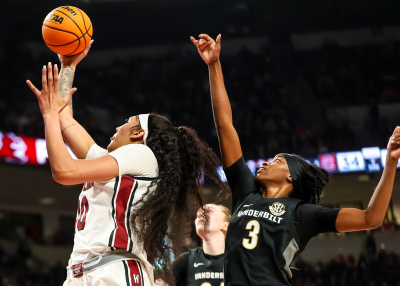 Jan 28, 2024; Columbia, South Carolina, USA; South Carolina Gamecocks center Kamilla Cardoso (10) drives past Vanderbilt Commodores guard Jordyn Cambridge (3) in the first half at Colonial Life Arena. Mandatory Credit: Jeff Blake-USA TODAY Sports