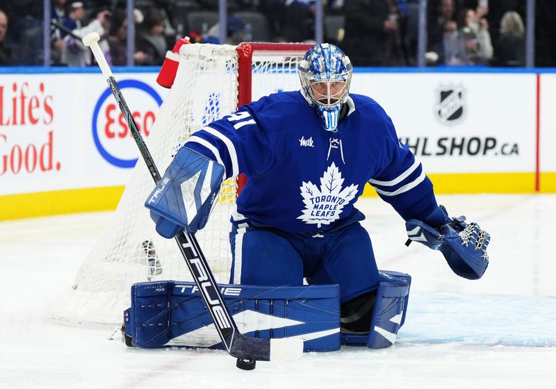 Nov 12, 2024; Toronto, Ontario, CAN; Toronto Maple Leafs goaltender Anthony Stolarz (41) stops the puck against the Ottawa Senators during the second period at Scotiabank Arena. Mandatory Credit: Nick Turchiaro-Imagn Images