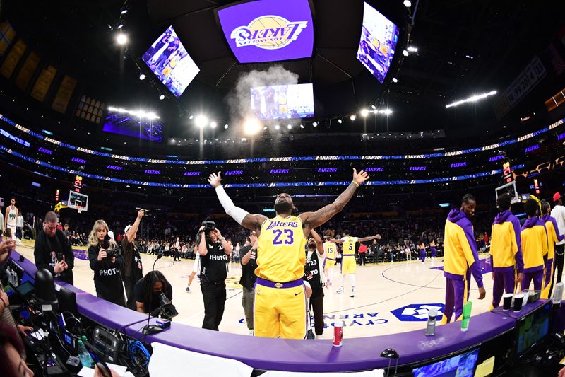 LOS ANGELES, CA - NOVEMBER 13: LeBron James #23 of the Los Angeles Lakers throws chalk before the game against the Memphis Grizzlies on November 13, 2024 at Crypto.Com Arena in Los Angeles, California. NOTE TO USER: User expressly acknowledges and agrees that, by downloading and/or using this Photograph, user is consenting to the terms and conditions of the Getty Images License Agreement. Mandatory Copyright Notice: Copyright 2024 NBAE (Photo by Adam Pantozzi/NBAE via Getty Images)