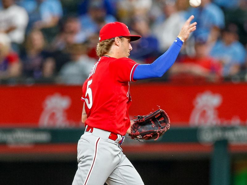 Apr 2, 2023; Arlington, Texas, USA; Philadelphia Phillies second baseman Bryson Stott (5) throws to first during the fourth inning against the Texas Rangers at Globe Life Field. Mandatory Credit: Andrew Dieb-USA TODAY Sports