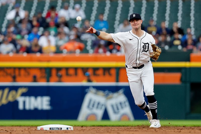 Sep 24, 2024; Detroit, Michigan, USA;  Detroit Tigers shortstop Trey Sweeney (27) makes a throw to first in the third inning against the Tampa Bay Rays at Comerica Park. Mandatory Credit: Rick Osentoski-Imagn Images