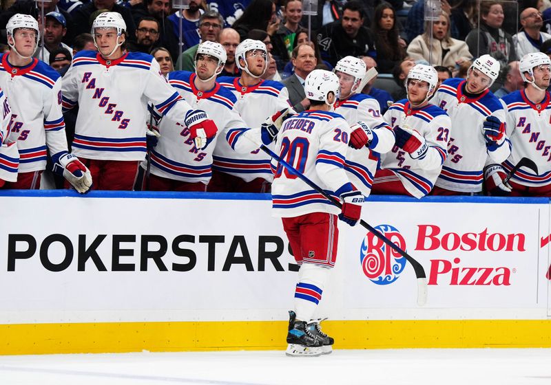 Oct 19, 2024; Toronto, Ontario, CAN; New York Rangers left wing Chris Kreider (20) celebrates at the bench after scoring a goal against the Toronto Maple Leafs during the second period at Scotiabank Arena. Mandatory Credit: Nick Turchiaro-Imagn Images