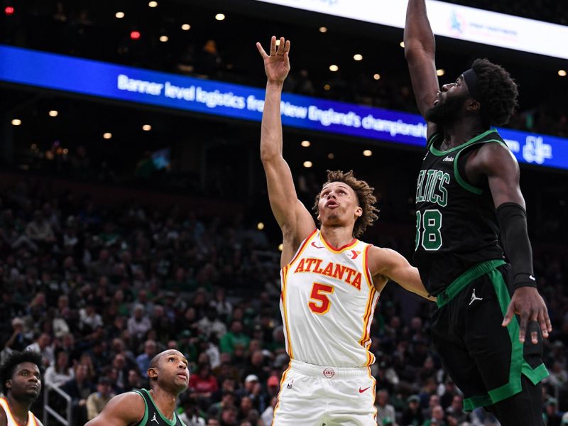 BOSTON, MASSACHUSETTS - NOVEMBER 12: Dyson Daniels #5 of the Atlanta Hawks shoots against Neemias Queta #88 of the Boston Celtics during the first half of an Emirates NBA cup game  at TD Garden on November 12, 2024 in Boston, Massachusetts. NOTE TO USER: User expressly acknowledges and agrees that, by downloading and or using this photograph, User is consenting to the terms and conditions of the Getty Images License Agreement. (Photo by China Wong/Getty Images)