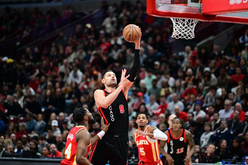 CHICAGO, IL - APRIL 1: Nikola Vucevic #9 of the Chicago Bulls drives to the basket during the game against the Atlanta Hawks on April 1, 2024 at United Center in Chicago, Illinois. NOTE TO USER: User expressly acknowledges and agrees that, by downloading and or using this photograph, User is consenting to the terms and conditions of the Getty Images License Agreement. Mandatory Copyright Notice: Copyright 2024 NBAE (Photo by Adam Hagy/NBAE via Getty Images)