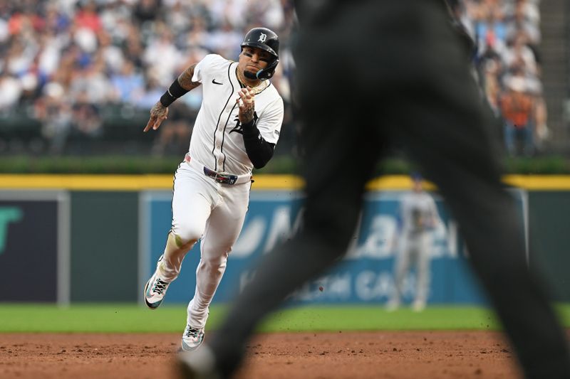 Jun 6, 2025; Detroit, Michigan, USA;  Detroit Tigers shortstop Javier Báez (28) runs to third base on a single by center fielder Parker Meadows (not pictured) against the Chicago Cubs in the fifth inning at Comerica Park. Mandatory Credit: Lon Horwedel-Imagn Images