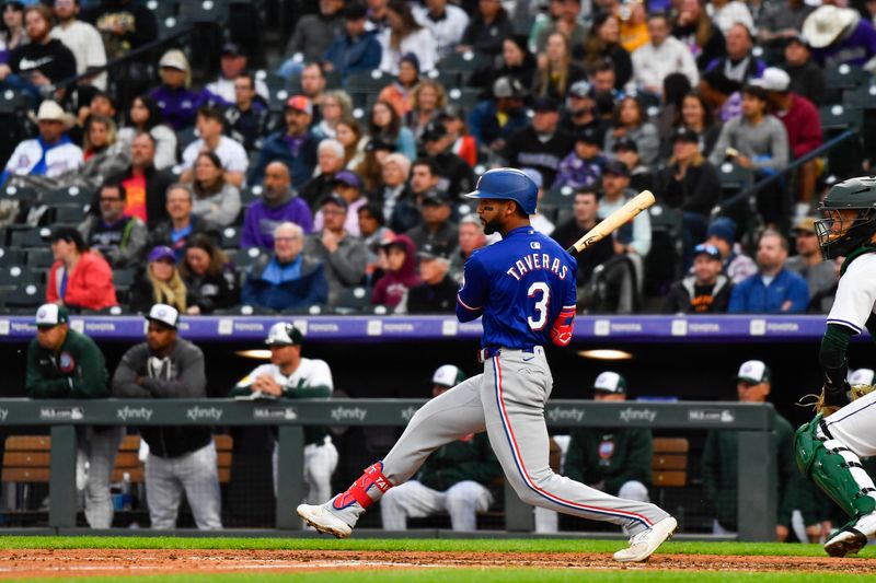 May 11, 2024; Denver, Colorado, USA; Texas Rangers outfielder Leody Taveras (3) singles against the Colorado Rockies in the fifth inning at Coors Field. Mandatory Credit: John Leyba-USA TODAY Sports