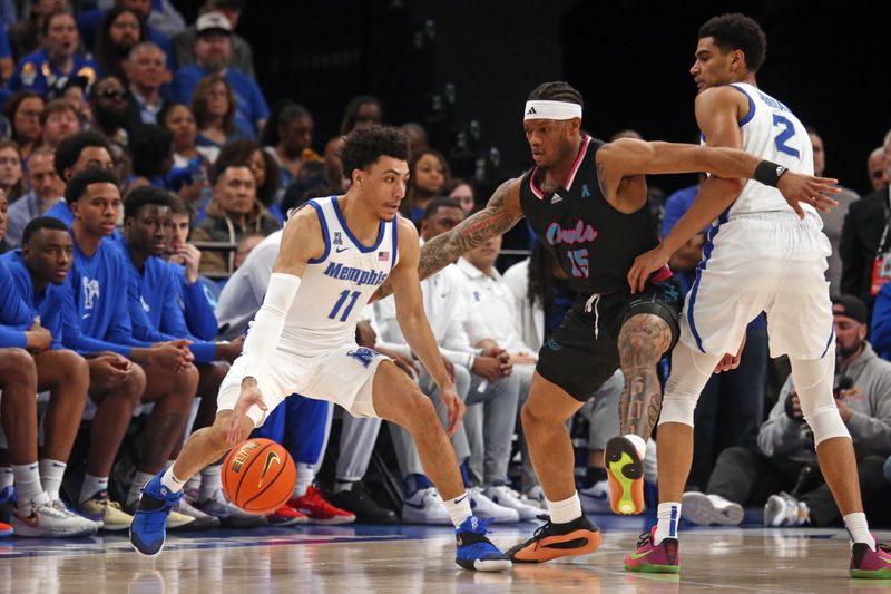 Feb 25, 2024; Memphis, Tennessee, USA; Memphis Tigers guard Jahvon Quinerly (11) dribbles as Florida Atlantic Owls guard Alijah Martin (15) defends during the second half at FedExForum. Mandatory Credit: Petre Thomas-USA TODAY Sports