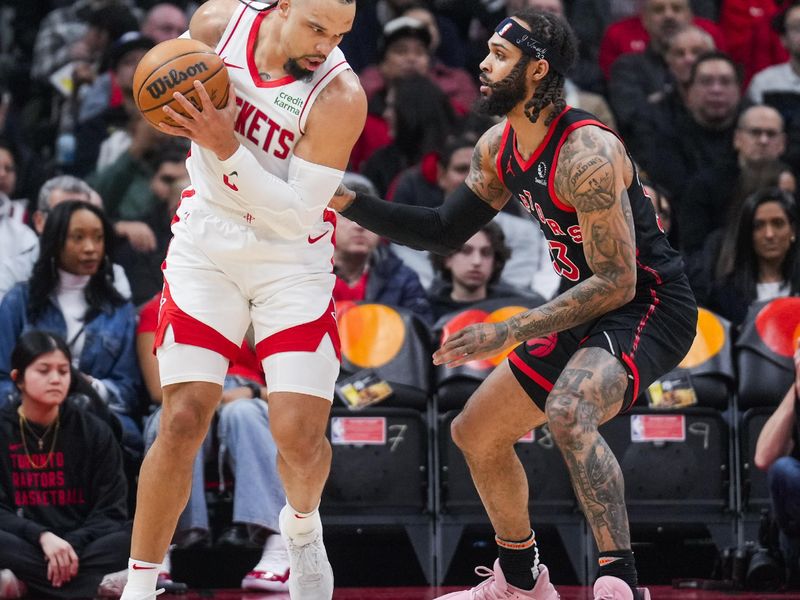 TORONTO, ON - FEBRUARY 9: Dillon Brooks #9 of the Houston Rockets is guarded by Gary Trent Jr. #33 of the Toronto Raptors during the first half of their basketball game at the Scotiabank Arena on February 9, 2024 in Toronto, Ontario, Canada. NOTE TO USER: User expressly acknowledges and agrees that, by downloading and/or using this Photograph, user is consenting to the terms and conditions of the Getty Images License Agreement. (Photo by Mark Blinch/Getty Images)