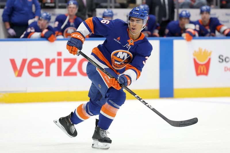 Nov 5, 2024; Elmont, New York, USA; New York Islanders defenseman Isaiah George (36) skates against the Pittsburgh Penguins during the second period at UBS Arena. Mandatory Credit: Brad Penner-Imagn Images