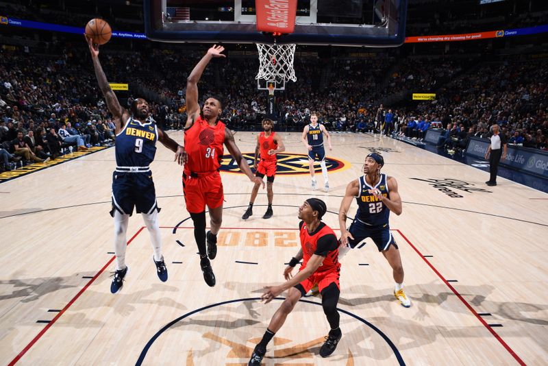 DENVER, CO - JANUARY 17: Davon Reed #9 of the Denver Nuggets drives to the basket during the game against the Portland Trail Blazers on January 17, 2023 at the Ball Arena in Denver, Colorado. NOTE TO USER: User expressly acknowledges and agrees that, by downloading and/or using this Photograph, user is consenting to the terms and conditions of the Getty Images License Agreement. Mandatory Copyright Notice: Copyright 2023 NBAE (Photo by Garrett Ellwood/NBAE via Getty Images)