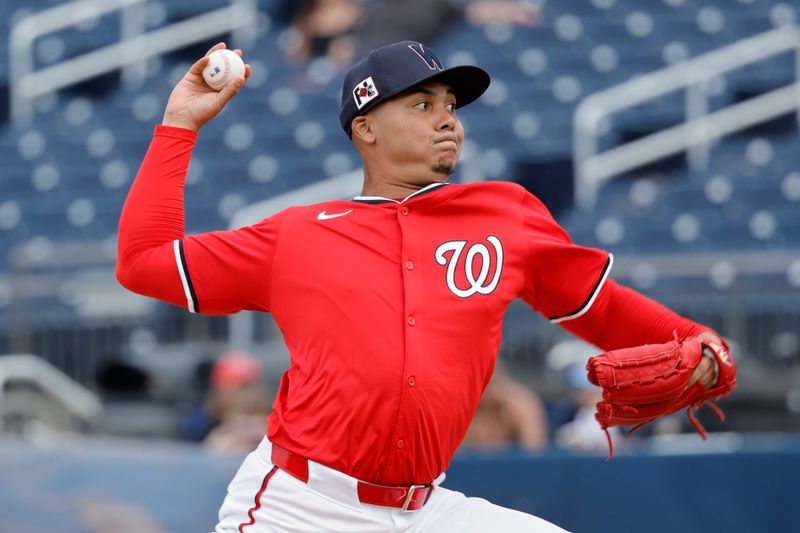 Feb 26, 2025; West Palm Beach, Florida, USA;  Washington Nationals pitcher Eduardo Salazar (62) throws a pitch during the sixth inning against the Houston Astros at CACTI Park of the Palm Beaches. Mandatory Credit: Reinhold Matay-Imagn Images