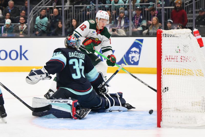 Dec 10, 2023; Seattle, Washington, USA; Minnesota Wild left wing Matt Boldy (12) scores a goal past Seattle Kraken goaltender Joey Daccord (35) during the first period at Climate Pledge Arena. Mandatory Credit: Steven Bisig-USA TODAY Sports