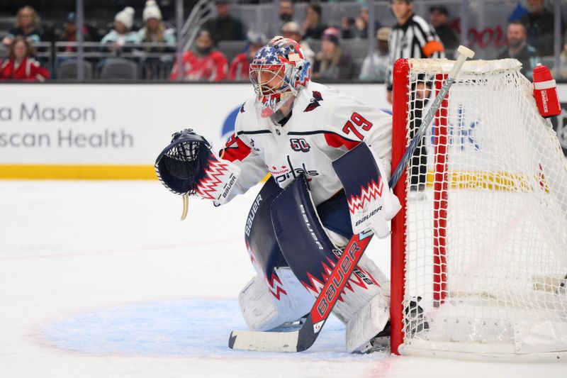 Jan 23, 2025; Seattle, Washington, USA; Washington Capitals goaltender Charlie Lindgren (79) defends the goal against the Seattle Kraken during the third period at Climate Pledge Arena. Mandatory Credit: Steven Bisig-Imagn Images