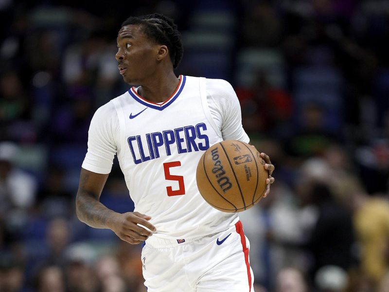 NEW ORLEANS, LOUISIANA - MARCH 15: Bones Hyland #5 of the LA Clippers dribbles the ball down court during first quarter of an NBA game against the New Orleans Pelicans at Smoothie King Center on March 15, 2024 in New Orleans, Louisiana. NOTE TO USER: User expressly acknowledges and agrees that, by downloading and or using this photograph, User is consenting to the terms and conditions of the Getty Images License Agreement. (Photo by Sean Gardner/Getty Images)