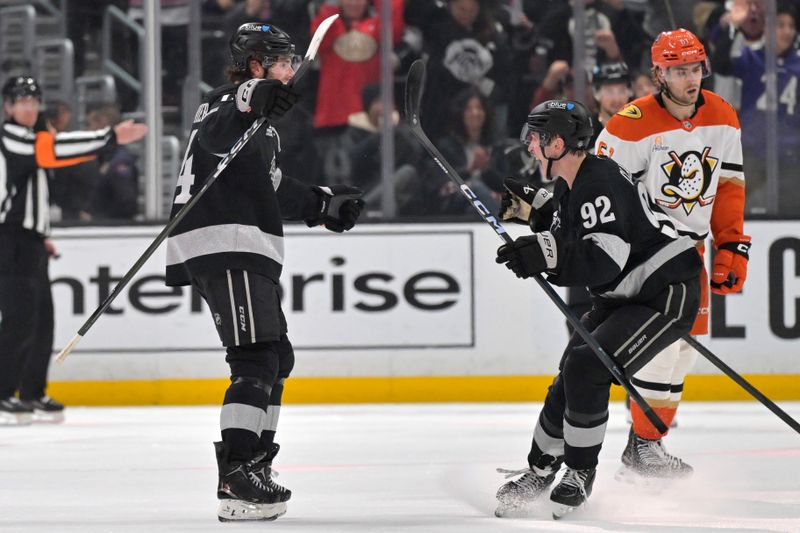 Dec 27, 2025; Los Angeles, California, USA;  Los Angeles Kings right wing Alex Laferriere (14) is congratulated by Los Angeles Kings defenseman Brandt Clarke (92) after scoring his first career hat trick in the third period against the Anaheim Ducks at Crypto.com Arena. Mandatory Credit: Jayne Kamin-Oncea-Imagn Images