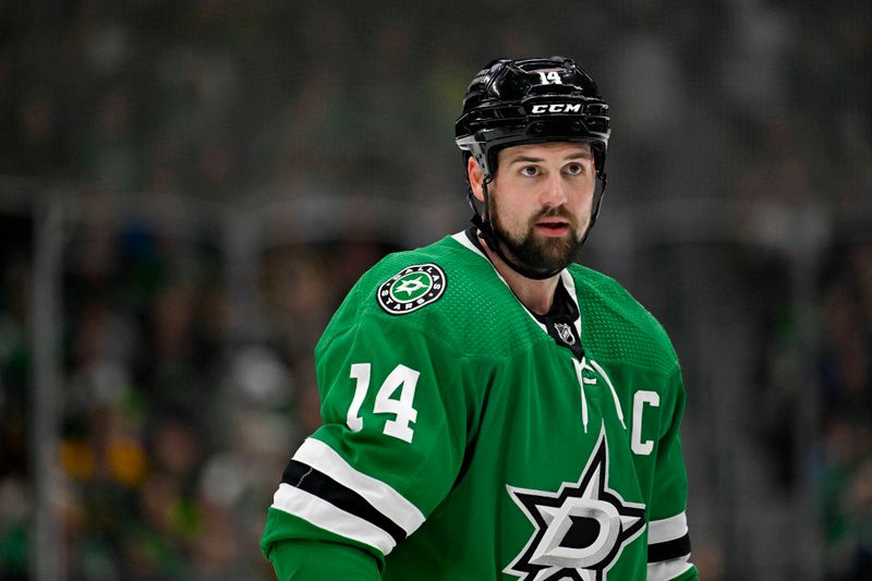 Mar 22, 2024; Dallas, Texas, USA; Dallas Stars left wing Jamie Benn (14) waits for the face-off against the Pittsburgh Penguins during the second period at the American Airlines Center. Mandatory Credit: Jerome Miron-USA TODAY Sports