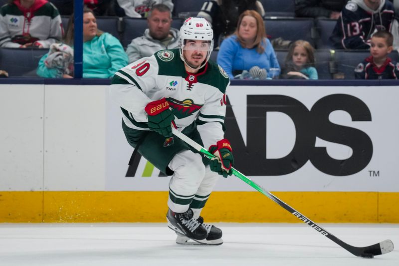 Jan 6, 2024; Columbus, Ohio, USA;  Minnesota Wild left wing Marcus Johansson (90) skates with the puck against the Columbus Blue Jackets in the third period at Nationwide Arena. Mandatory Credit: Aaron Doster-USA TODAY Sports