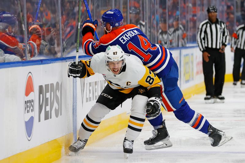 Oct 25, 2024; Edmonton, Alberta, CAN; Pittsburgh Penguins forward Sidney Crosby (87) avoids a hit from Edmonton Oilers defensemen Mattias Ekholm (14) during the second period at Rogers Place. Mandatory Credit: Perry Nelson-Imagn Images