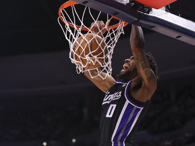 DENVER, COLORADO - FEBRUARY 28: Malik Monk #0 of the Sacramento Kings dunks the ball during the game against the Denver Nuggets at Ball Arena on February 28, 2024 in Denver, Colorado. NOTE TO USER: User expressly acknowledges and agrees that, by downloading and or using this photograph, User is consenting to the terms and conditions of the Getty Images License Agreement. (Photo by Alysa Rubin/Clarkson Creative/Getty Images)