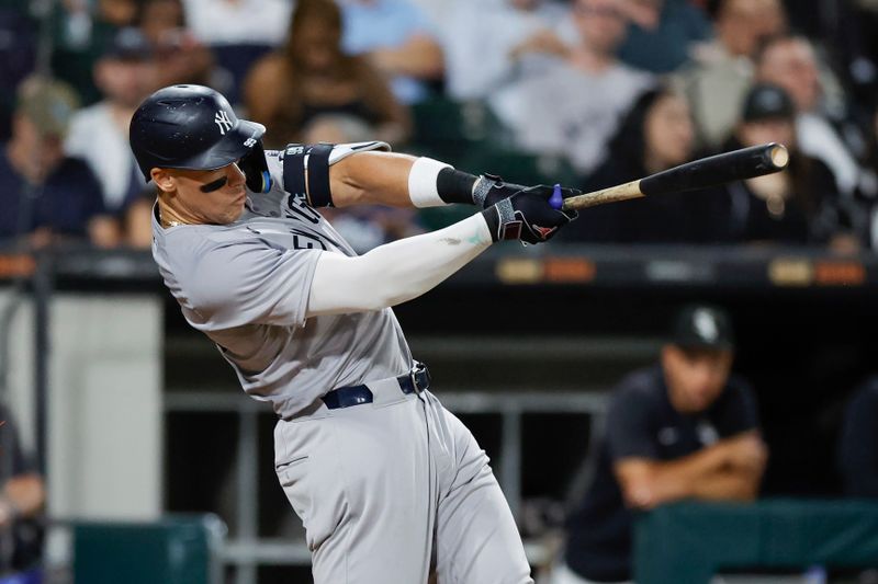 Aug 13, 2024; Chicago, Illinois, USA; New York Yankees outfielder Aaron Judge (99) singles against the Chicago White Sox during the seventh inning at Guaranteed Rate Field. Mandatory Credit: Kamil Krzaczynski-USA TODAY Sports