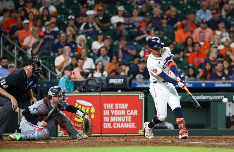 Jul 9, 2024; Houston, Texas, USA;  Houston Astros shortstop Jeremy Pena (3) hits a double against the Miami Marlins in the fifth inning at Minute Maid Park. Mandatory Credit: Thomas Shea-USA TODAY Sports