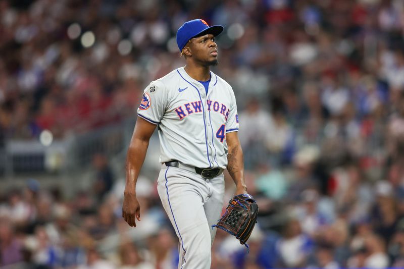 Sep 24, 2024; Atlanta, Georgia, USA; New York Mets relief pitcher Huascar Brazoban (43) walks off the field after pitching against the Atlanta Braves in the sixth inning at Truist Park. Mandatory Credit: Brett Davis-Imagn Images