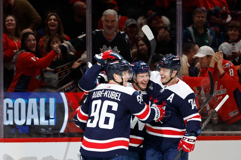 Mar 9, 2024; Washington, District of Columbia, USA; Washington Capitals center Michael Sgarbossa (23) celebrates with teammates after scoring a goal against the Chicago Blackhawks in the first period at Capital One Arena. Mandatory Credit: Geoff Burke-USA TODAY Sports