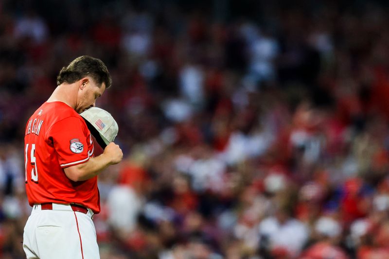 May 17, 2025; Cincinnati, Ohio, USA; Cincinnati Reds relief pitcher Emilio Pagan (15) prepares to pitch in the ninth inning against the Cleveland Guardians at Great American Ball Park. Mandatory Credit: Katie Stratman-Imagn Images