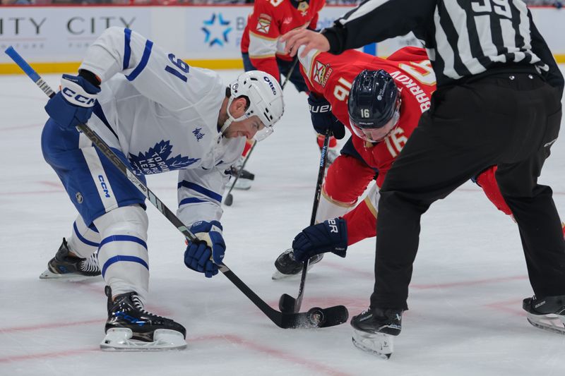 Nov 27, 2024; Sunrise, Florida, USA; Florida Panthers center Aleksander Barkov (16) and Toronto Maple Leafs center John Tavares (91) face-off during the first period at Amerant Bank Arena. Mandatory Credit: Sam Navarro-Imagn Images