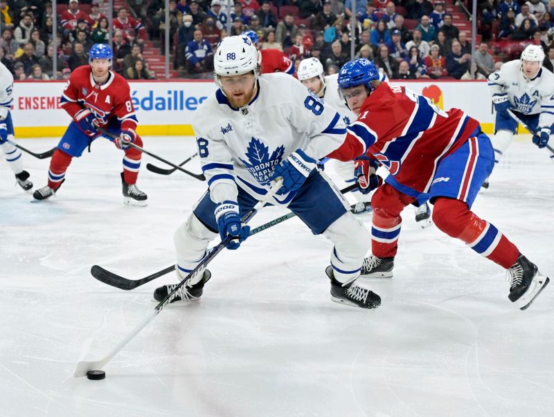 Mar 9, 2024; Montreal, Quebec, CAN; Toronto Maple Leafs forward William Nylander (88) plays the puck and Montreal Canadiens defenseman Kaiden Guhle (21) defends during the third period at the Bell Centre. Mandatory Credit: Eric Bolte-USA TODAY Sports