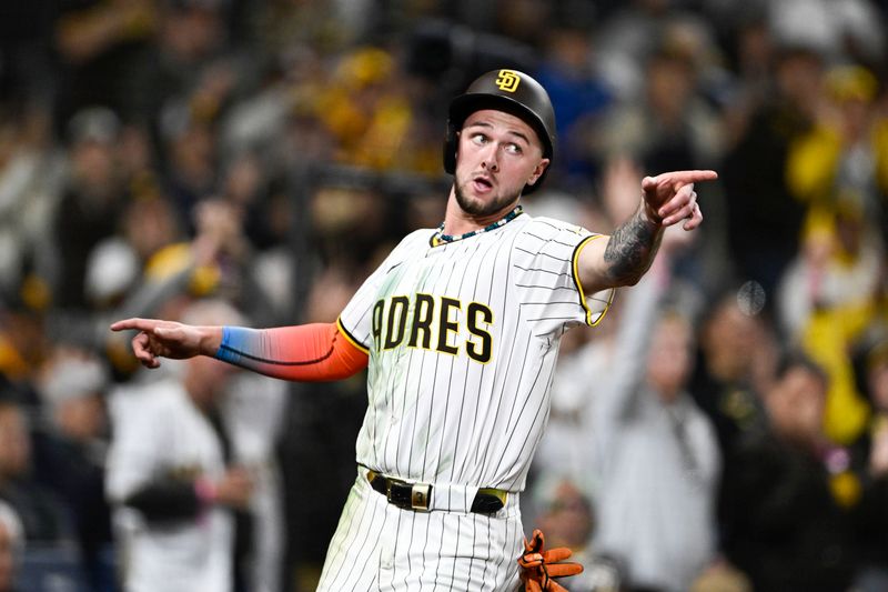 May 12, 2025; San Diego, California, USA; San Diego Padres center fielder Jackson Merrill (3) celebrates after scoring during the eighth inning against the Los Angeles Angels at Petco Park. Mandatory Credit: Denis Poroy-Imagn Images