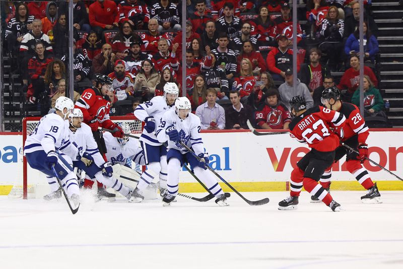 Oct 10, 2024; Newark, New Jersey, USA; New Jersey Devils left wing Jesper Bratt (63) scores a goal against the Toronto Maple Leafs during the first period at Prudential Center. Mandatory Credit: Ed Mulholland-Imagn Images