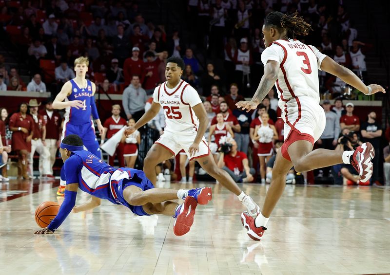 Feb 11, 2023; Norman, Oklahoma, USA; Kansas Jayhawks guard Dajuan Harris Jr. (3) dives for a loose ball against the Oklahoma Sooners during the second half at Lloyd Noble Center. Kansas won 78-55. Mandatory Credit: Alonzo Adams-USA TODAY Sports