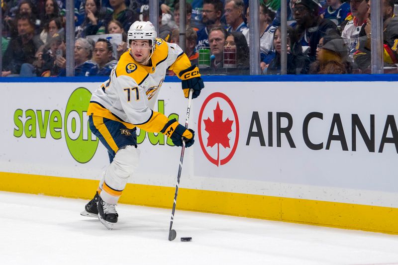 Apr 21, 2024; Vancouver, British Columbia, CAN; Nashville Predators forward Luke Evangelista (77) handles the puck against the Vancouver Canucks in the second period in game one of the first round of the 2024 Stanley Cup Playoffs at Rogers Arena. Mandatory Credit: Bob Frid-USA TODAY Sports