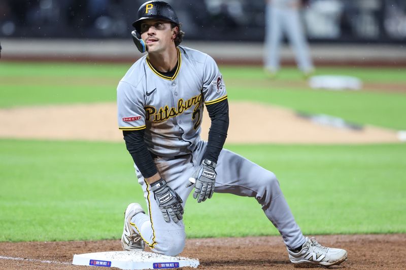 May 13, 2025; New York City, New York, USA; Pittsburgh Pirates second baseman Adam Frazier (26) gets back to first base after a pick off attempt in the fifth inning against the New York Mets at Citi Field. Mandatory Credit: Wendell Cruz-Imagn Images