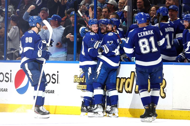 Feb 9, 2023; Tampa, Florida, USA; Tampa Bay Lightning left wing Brandon Hagel (38) celebrates with teammates after he scores a goal against the Colorado Avalanche during the second period at Amalie Arena. Mandatory Credit: Kim Klement-USA TODAY Sports