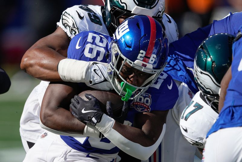 New York Giants running back Devin Singletary (26) carries the ball against the Philadelphia Eagles during the second quarter of an NFL football game, Sunday, Oct. 20, 2024, in East Rutherford, N.J. (AP Photo/Seth Wenig)