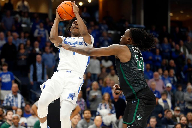 Feb 11, 2024; Memphis, Tennessee, USA; Memphis Tigers forward Nae'Qwan Tomlin (7) shoots as Tulane Green Wave forward Kevin Cross (24) defends during the first half at FedExForum. Mandatory Credit: Petre Thomas-USA TODAY Sports