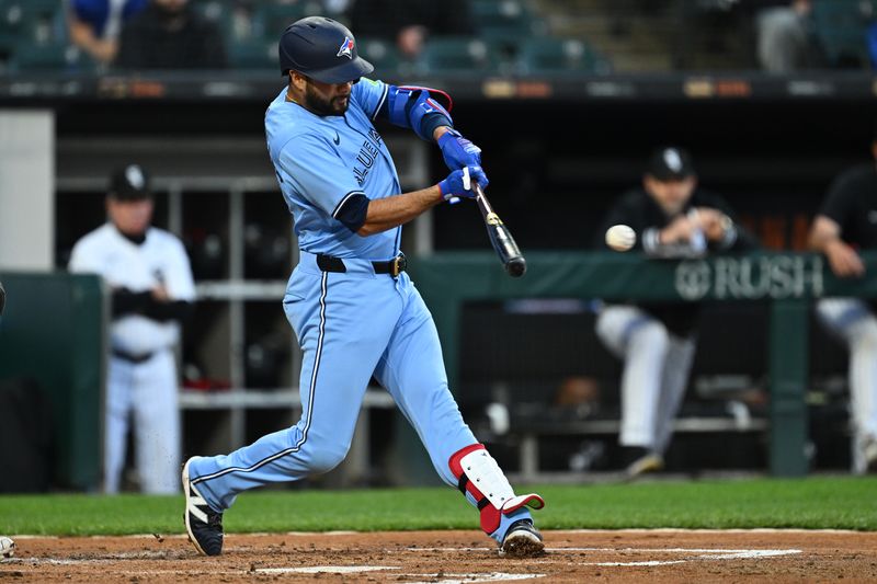 May 28, 2024; Chicago, Illinois, USA;  Toronto Blue Jays infielder Isiah Kiner-Falefa (7) hits a RBI double in the second inning against the Chicago White Sox at Guaranteed Rate Field. Mandatory Credit: Jamie Sabau-USA TODAY Sports
